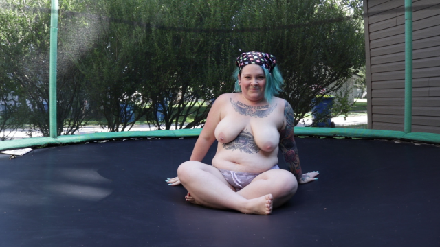 Topless Woman Jumping On A Trampoline